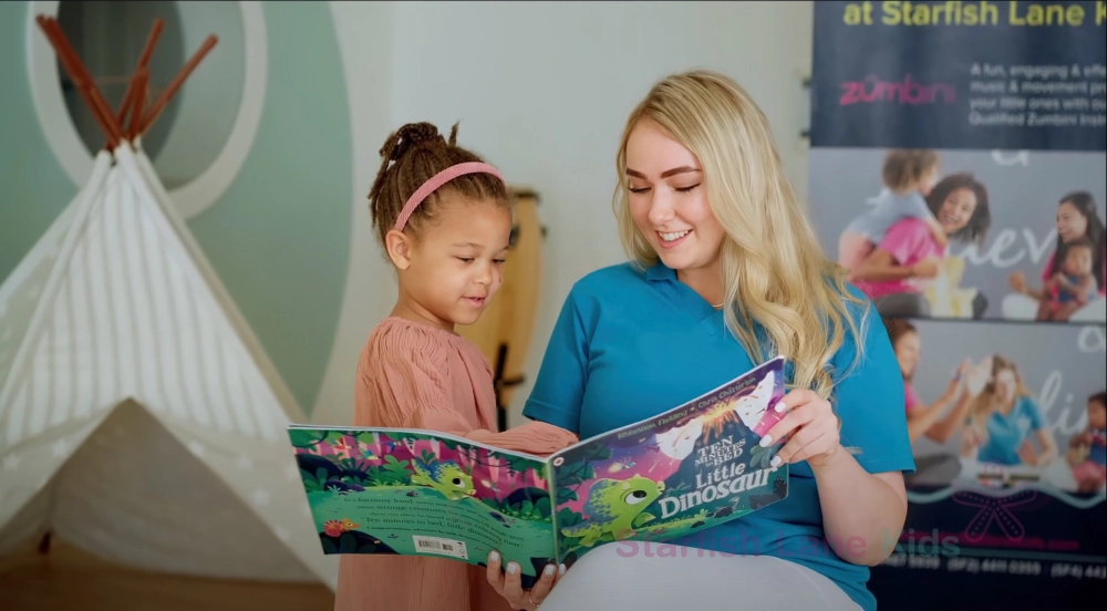 Starfish Lane Kids educator reading with a child